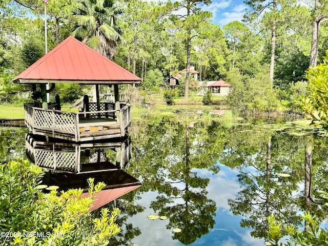 dock area with a water view and a gazebo