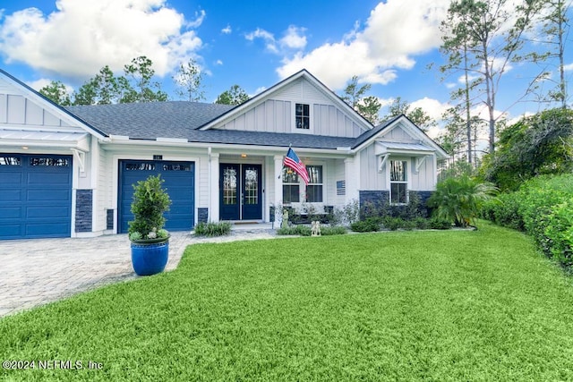 view of front facade featuring a front yard and a garage