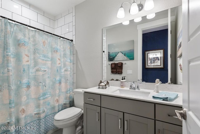 bathroom with walk in shower, vanity, and toilet