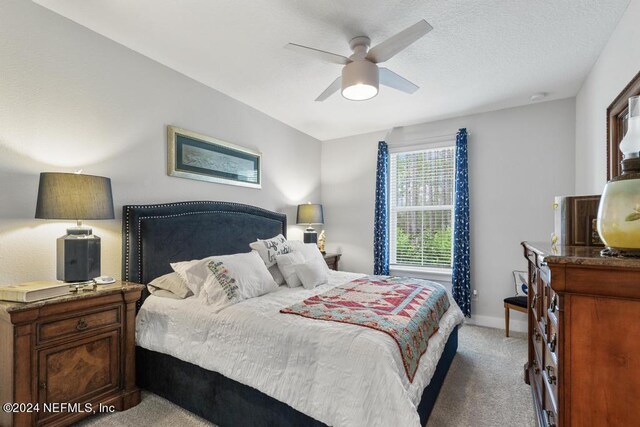 bedroom featuring ceiling fan and carpet floors