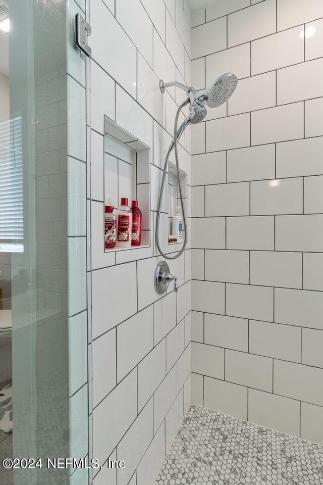 bathroom featuring an enclosed shower