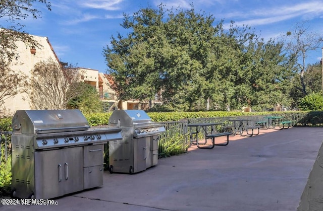 view of patio / terrace featuring an outdoor kitchen and a grill