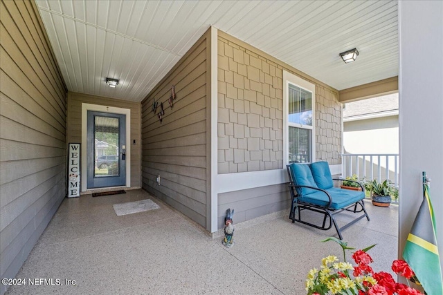 property entrance featuring a porch