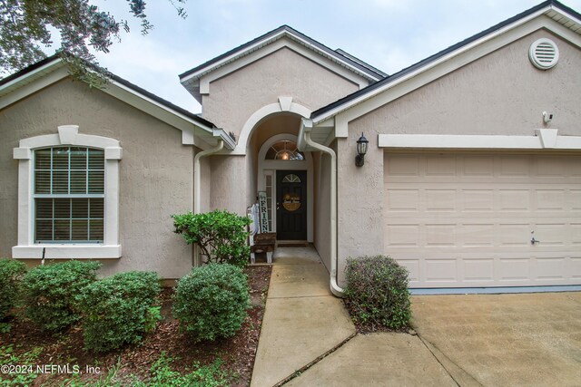 single story home with a garage