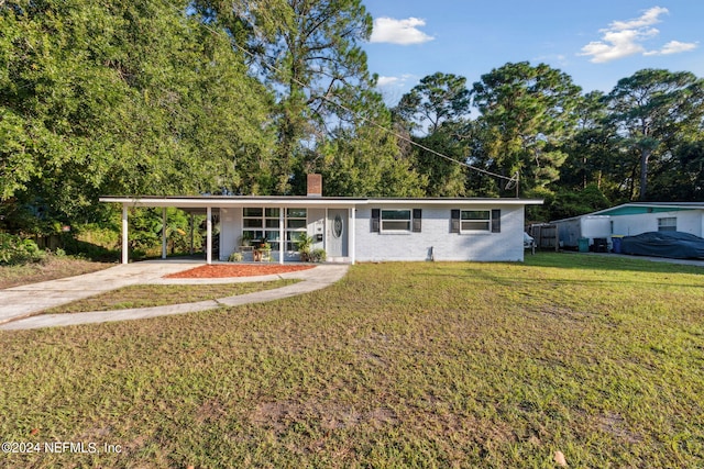 single story home featuring a front yard and a carport