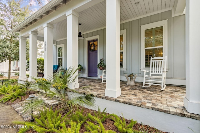 doorway to property with a porch