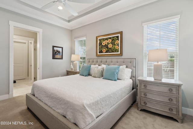 bedroom featuring ornamental molding, multiple windows, and ceiling fan