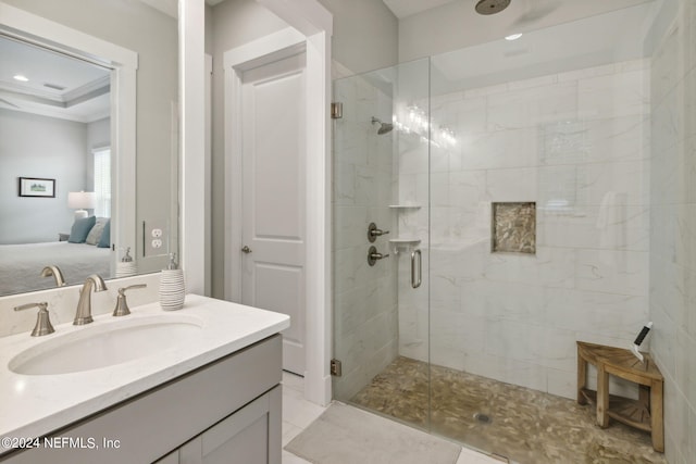 bathroom featuring tile patterned floors, a shower with door, and vanity