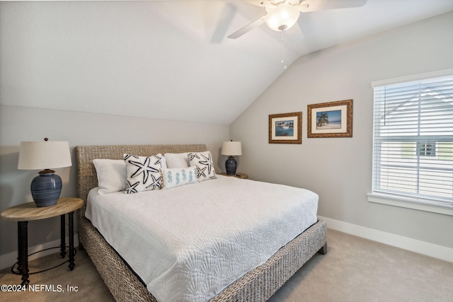 carpeted bedroom featuring ceiling fan and lofted ceiling