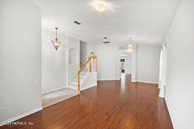 unfurnished room with dark wood-type flooring