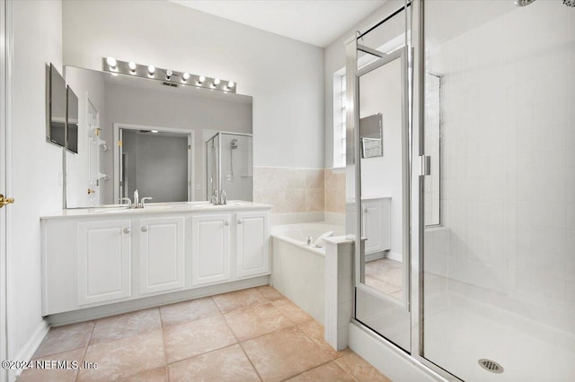 bathroom with vanity, shower with separate bathtub, and tile patterned floors