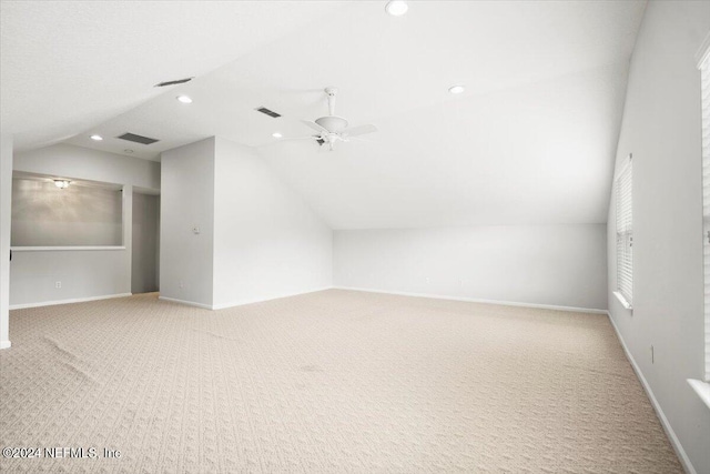 additional living space featuring lofted ceiling, ceiling fan, and carpet flooring