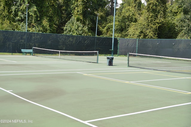 view of tennis court featuring basketball court