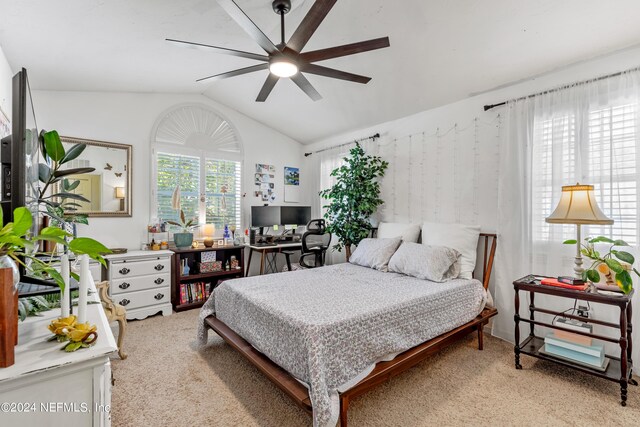 bedroom featuring vaulted ceiling, ceiling fan, and light colored carpet