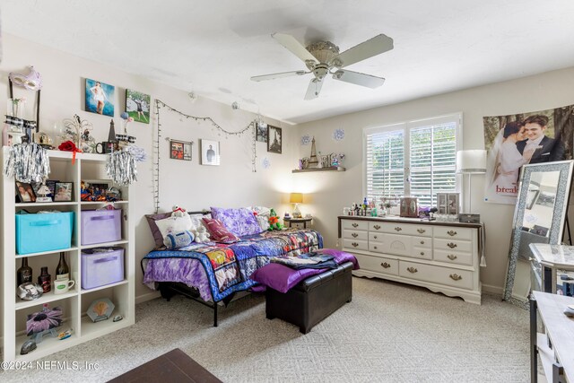 carpeted bedroom featuring ceiling fan