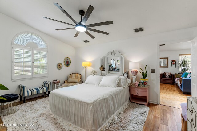 bedroom featuring ceiling fan and light hardwood / wood-style flooring