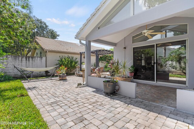 view of patio featuring ceiling fan