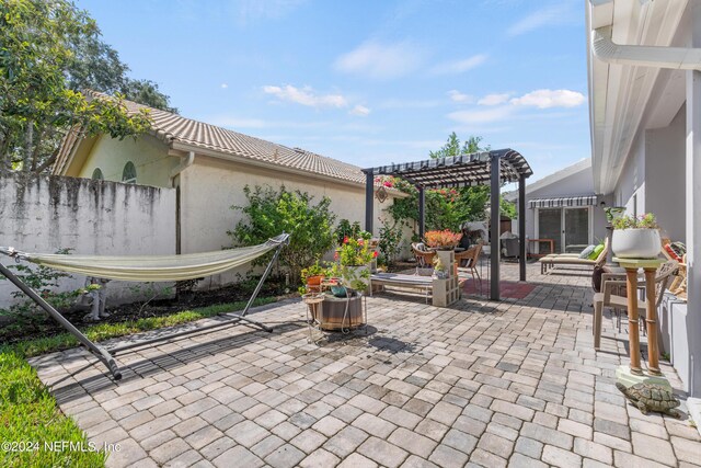 view of patio featuring a pergola