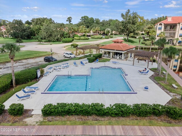 view of swimming pool featuring a patio area