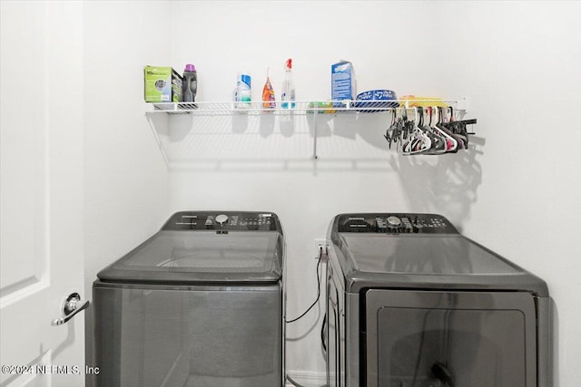 laundry area with separate washer and dryer