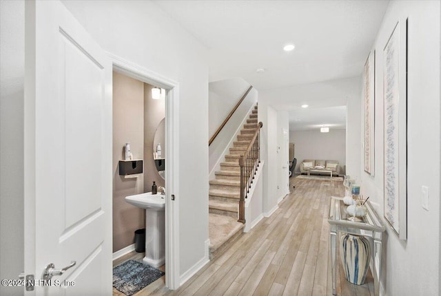 foyer entrance with light wood-type flooring