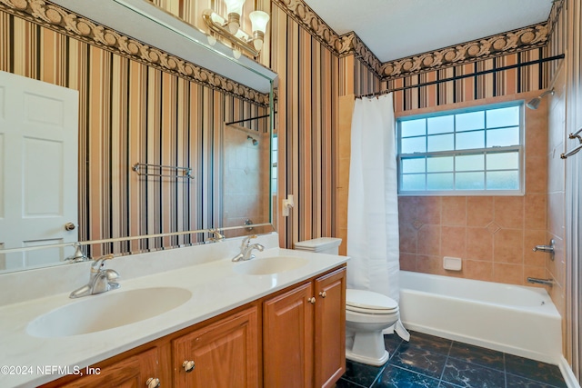 full bathroom featuring vanity, toilet, and shower / tub combo with curtain