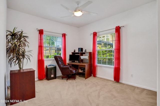 office featuring light carpet and ceiling fan