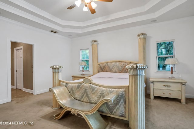 bedroom featuring light carpet, multiple windows, ornamental molding, and ceiling fan