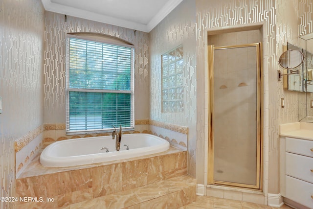 bathroom with vanity, crown molding, and plus walk in shower