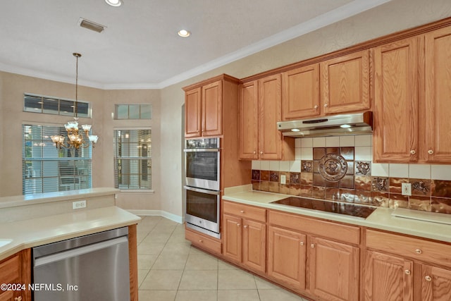 kitchen featuring appliances with stainless steel finishes, hanging light fixtures, crown molding, a notable chandelier, and light tile patterned floors