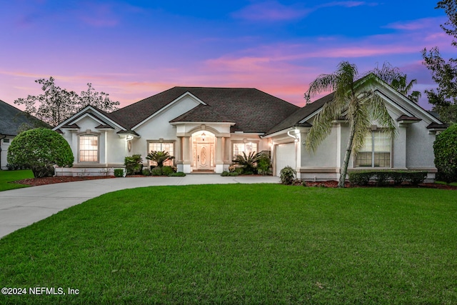 view of front of property with a yard