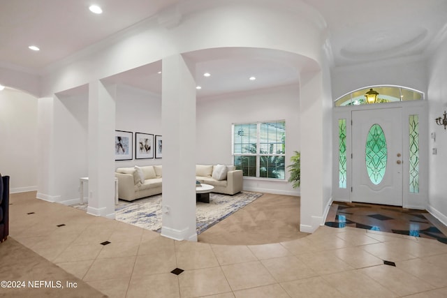 tiled foyer with crown molding