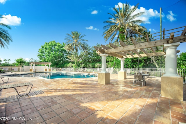 view of pool with a pergola and a patio area