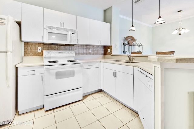 kitchen with pendant lighting, sink, white cabinets, decorative backsplash, and white appliances