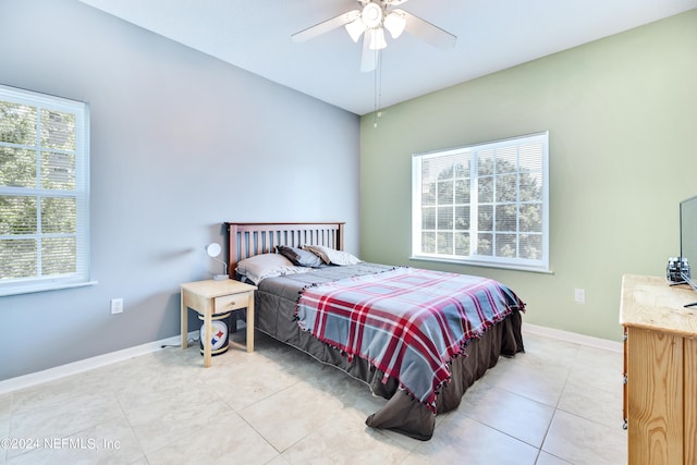 bedroom featuring ceiling fan and light tile patterned floors