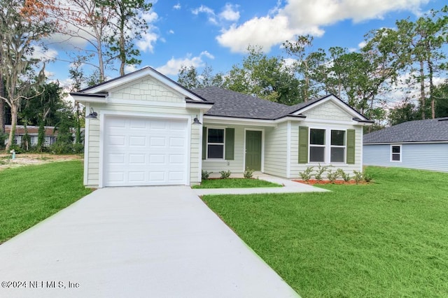 ranch-style house featuring a garage and a front yard