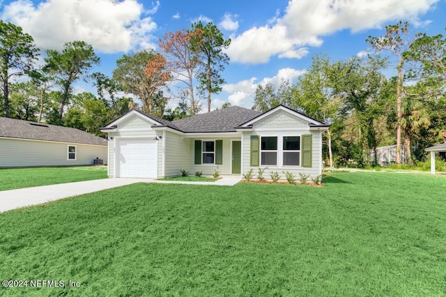 view of front of house with a garage and a front lawn