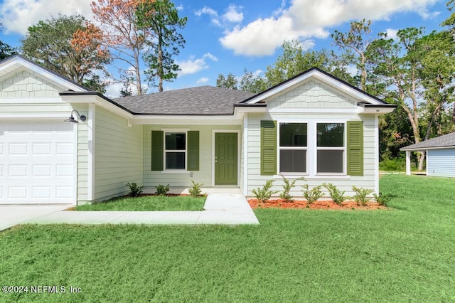 single story home with a front yard and a garage