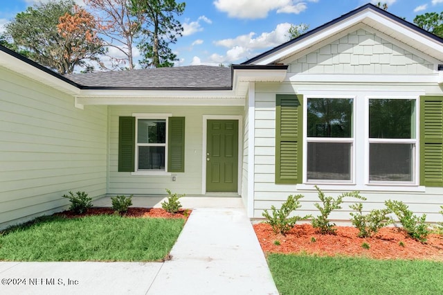 entrance to property with covered porch