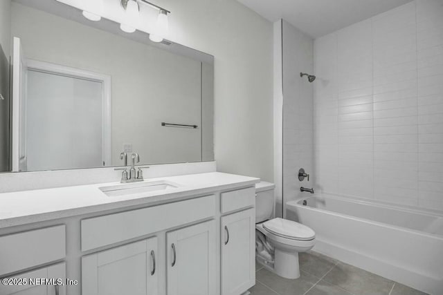 bathroom featuring shower / bath combination, tile patterned flooring, toilet, and vanity