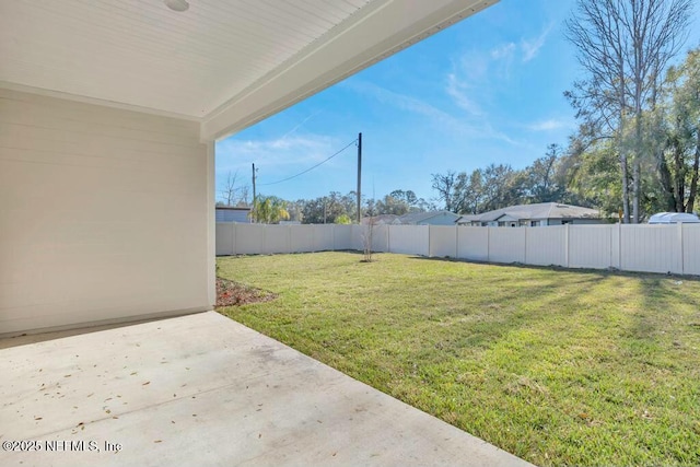 view of yard featuring a patio area and a fenced backyard