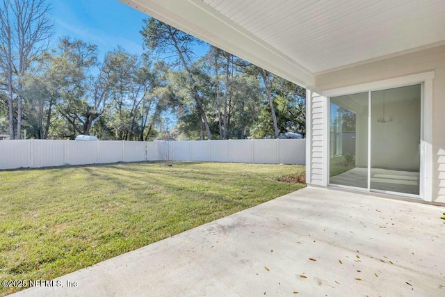 view of yard with a patio and fence