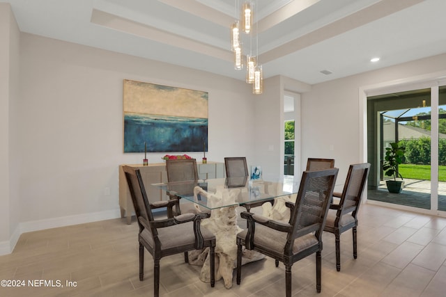 dining room featuring a tray ceiling