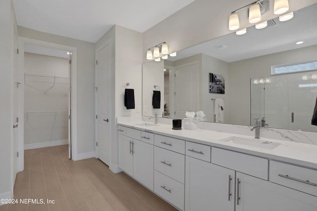 bathroom with vanity and an enclosed shower