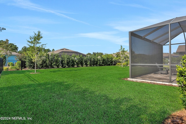 view of yard with a lanai