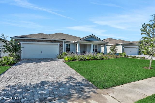 ranch-style house featuring a garage and a front yard