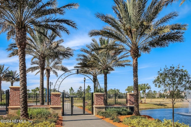 surrounding community with a water view