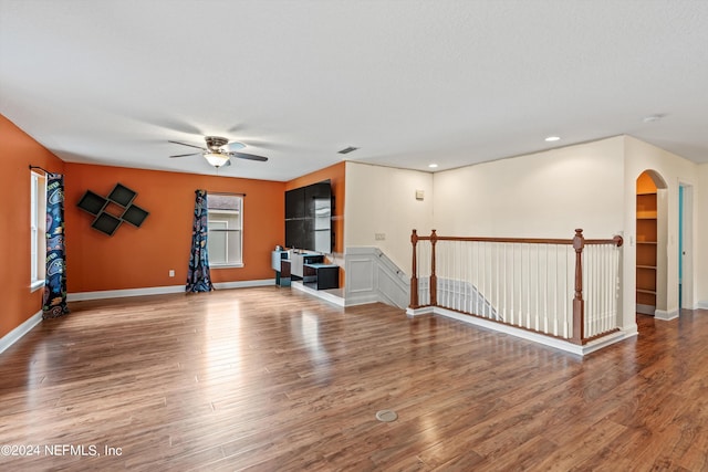 spare room with ceiling fan and hardwood / wood-style flooring