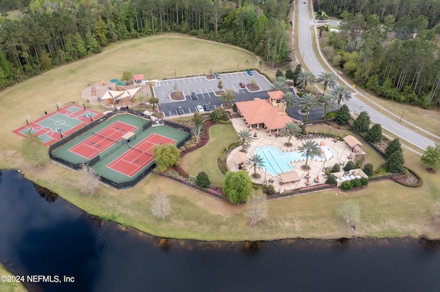 birds eye view of property with a water view