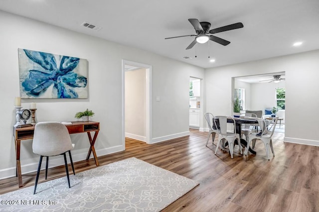 dining space featuring ceiling fan and hardwood / wood-style floors